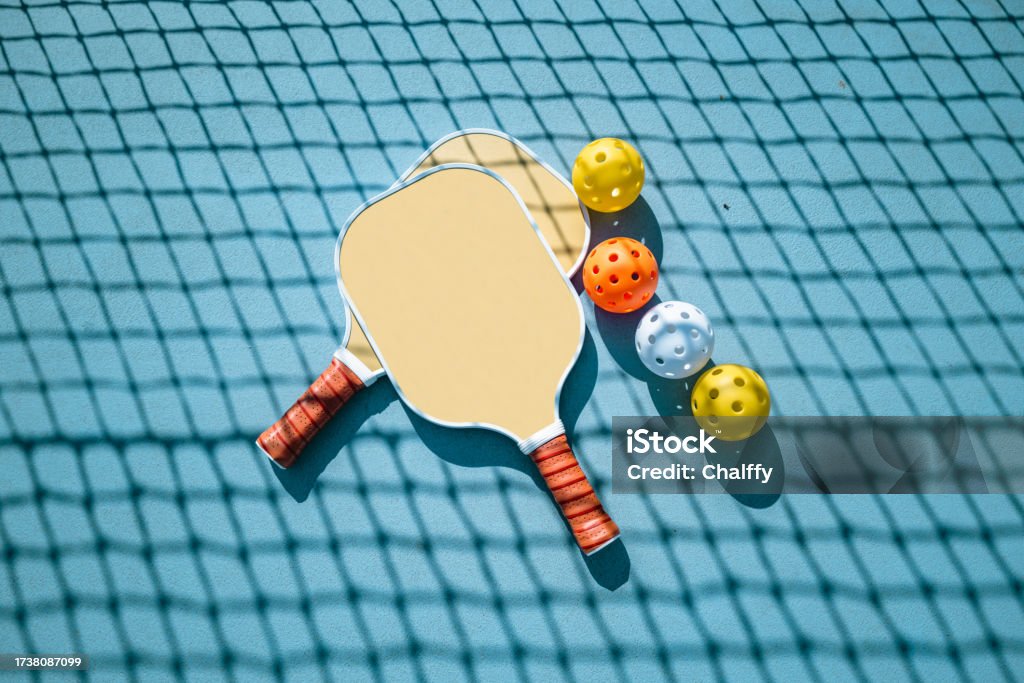 Adults Playing Pickleball on a Public Court Pickleball Stock Photo