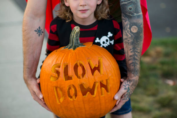 istock Slow Down Carved in Halloween Pumpkin 1738088160