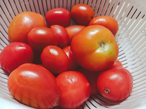 Bunch of tomatoes in a basket.