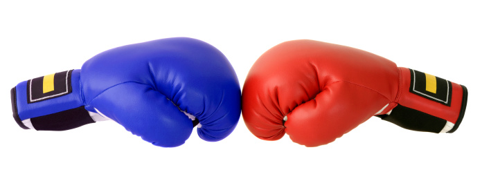 Close up of the boxing-gloves on the white background.