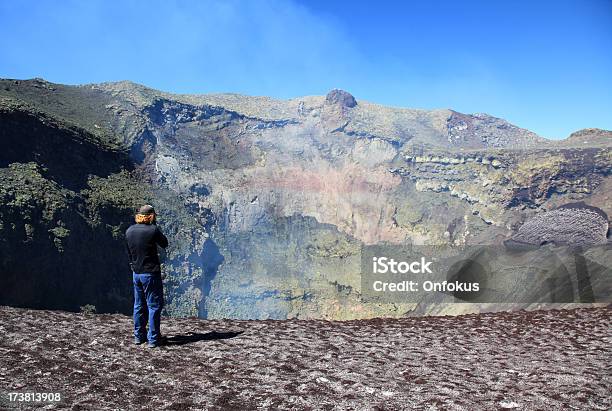 Man Standing Near The Smoking Crater Of Villarrica Volcano Chile Stock Photo - Download Image Now