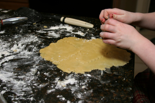 Child's hands making cookies
