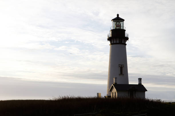 istock Lighthouse Standing On Hill With Cloudy Sky Newport Oregon 1738160537