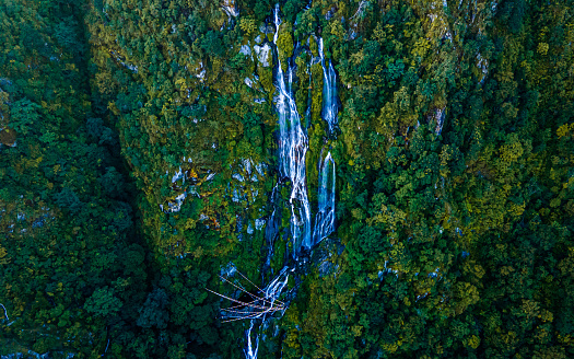 Drone view of Tindhare waterfall in middle of forest, Kavre, Nepal.