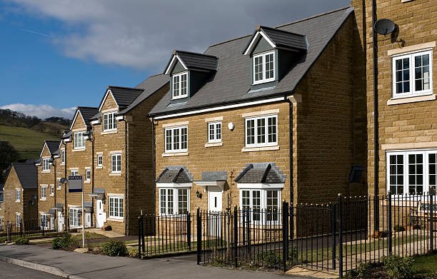 Houses for sale "Row of newly built houses for sale. Buxton, Derbyshire, UK." peak district national park photos stock pictures, royalty-free photos & images