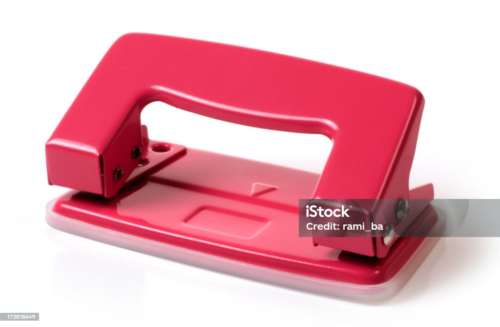 Red hole puncher Office hole puncher isolated on a white background. Cut Out Stock Photo Red hole puncher Office hole puncher isolated on a white background. Cut Out Stock Photo