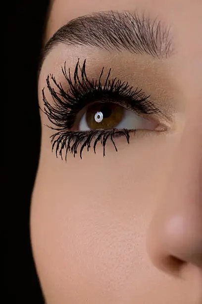 Thick eye lashes on a beautiful model.