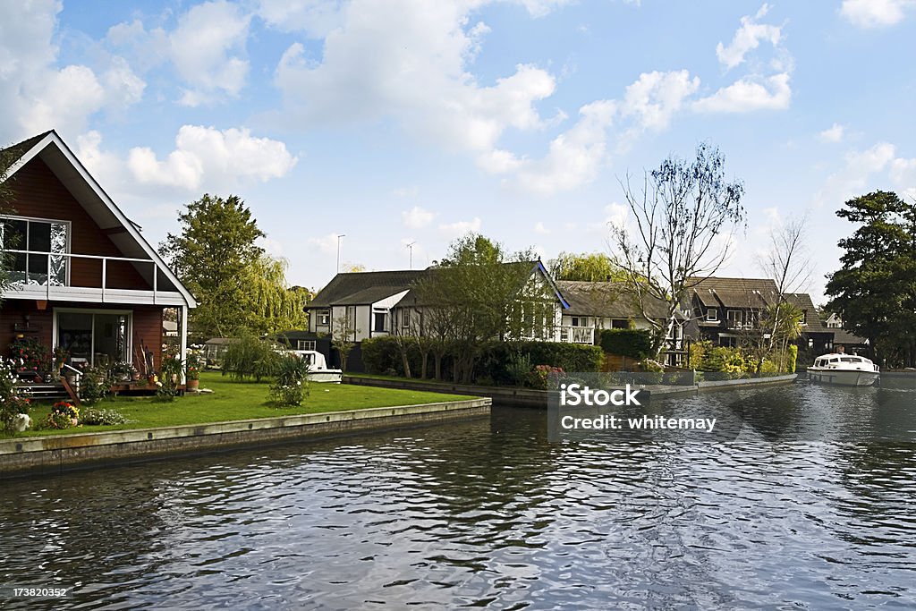 Riverside cottages Cottages alongside the River Bure in the Norfolk Broads. Bungalow Stock Photo