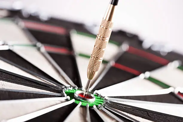 Photo of Dart in the center of dartboard