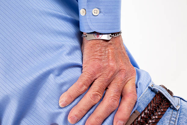 istock Senor holding back in pain 173820829