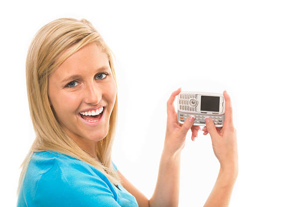istock Cute Young Blonde Woman Laughs While Text Messaging 173821409