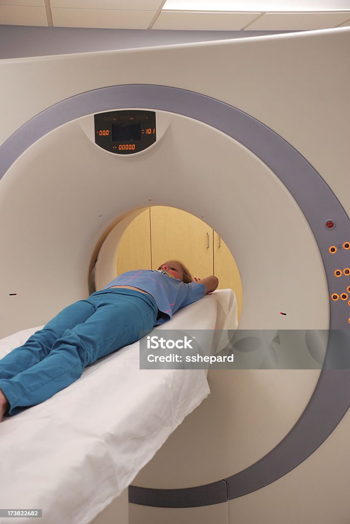 Child in CT Scan Child receiving CT Scan CAT Scan Stock Photo