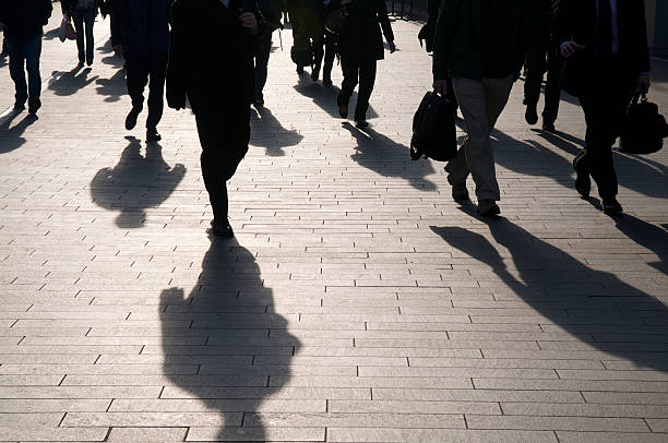 istock Crowd of Shadow Pedestrian Businesspeople Walking Sidewalk 173822743