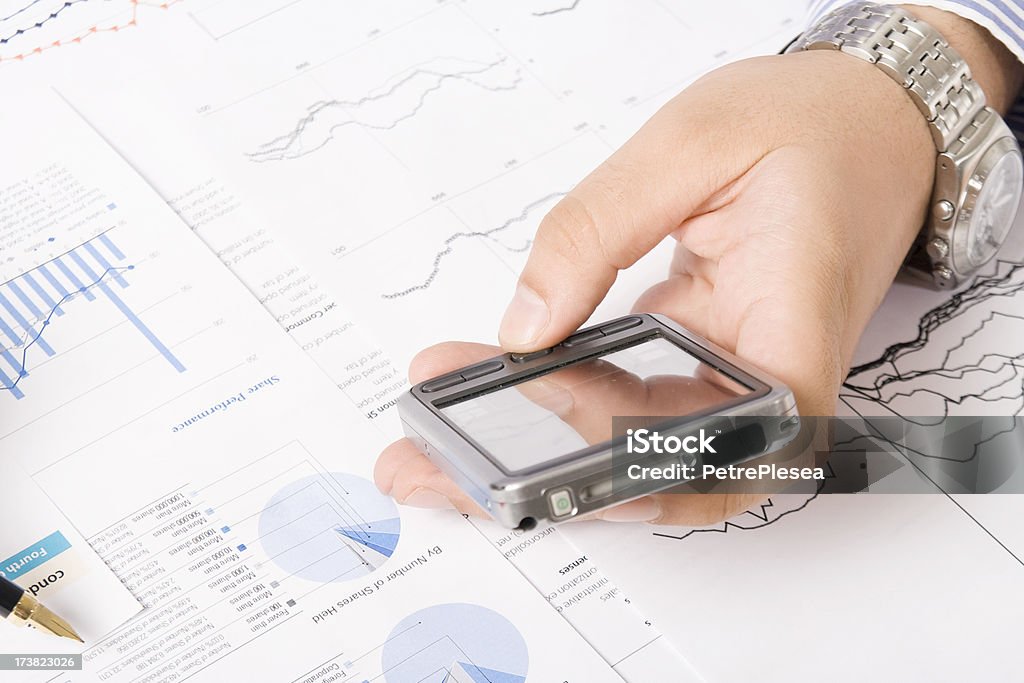 Analyzing and calculating financial data reports Analyzing and calculating financial data reports. Close up. Selective focus.More financials in this lightbox Analyzing Stock Photo