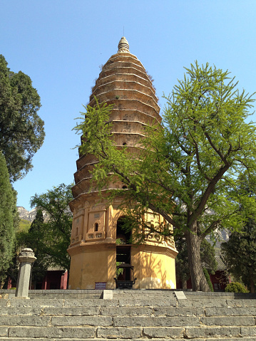 Zhengzhou, Hennan- April 13, 2013: Songshan Mountain, aka Mount Song, lies in Dengfeng city, in the heart of Henan Province and about 80 kilometers (50 miles) east of its capital, Zhengzhou. It is also known as Zhong Yue (middle mountain), is known as one of the Five Mountains of China. Here is the pagoda of Songyue Temple, built in the Northern Wei Dynasty, about 1400 years ago. It is the oldest brick pagoda in China.