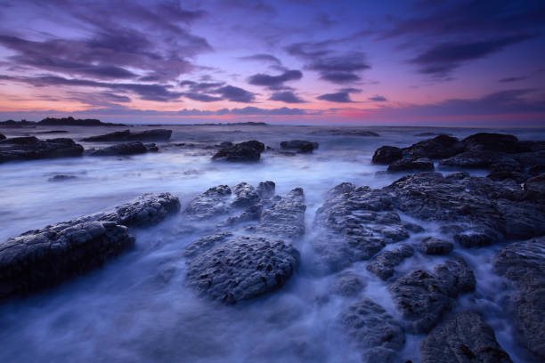 Coastal image with slow shutter speed to show movement in the sea.