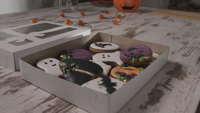 Cardboard box with adorable Halloween themed cookies