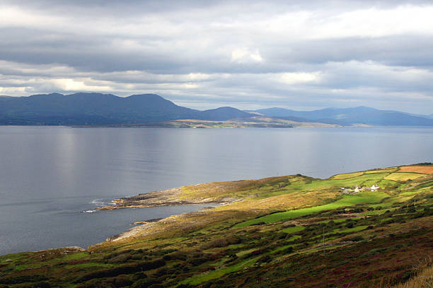 The Atlantic Coast of Ireland Sheeps Head Peninsula "Sheepshead Peninsula, View to Beara, West Coast of Ireland, with remote farmhouse" tidal inlet stock pictures, royalty-free photos & images