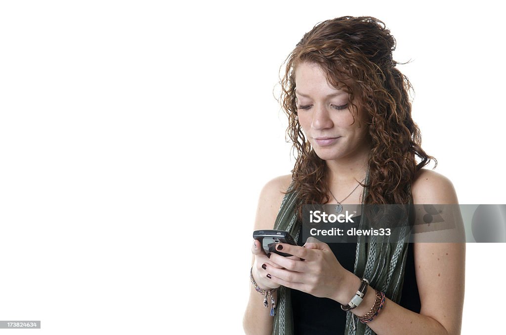 Ragazza adolescente, l'invio di SMS - Foto stock royalty-free di Scontornabile