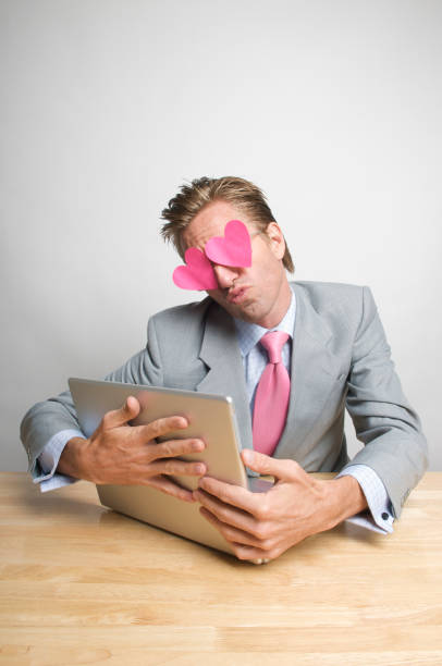 istock Smoochy Guy Hugs His Laptop 173824955