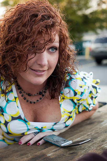 Woman outside at a restaurant 3 stock photo