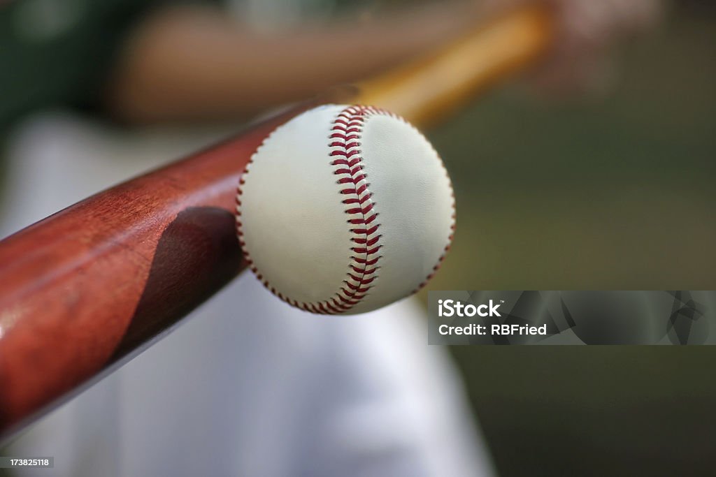 Slugger a baseball player hitting a ball Batting - Sports Activity Stock Photo