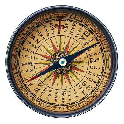Magnetic old compass on world map.Travel, geography, navigation, tourism and exploration concept background. Macro photo. Very shallow focus.