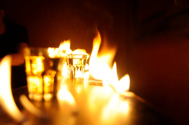 istock fire on bar counter with shot glass 173826835