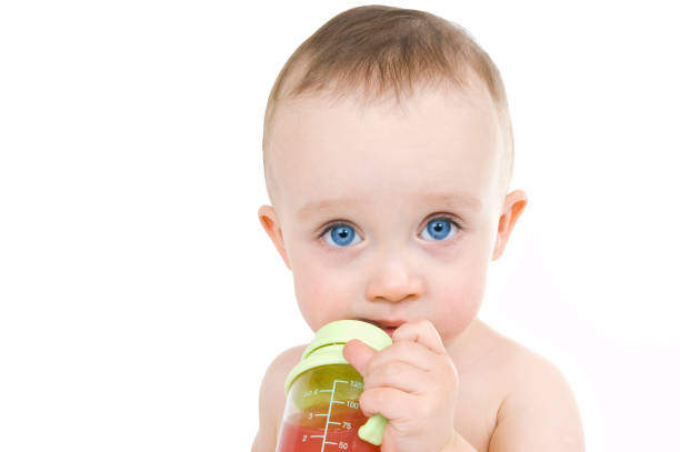 Baby drinking stock photo