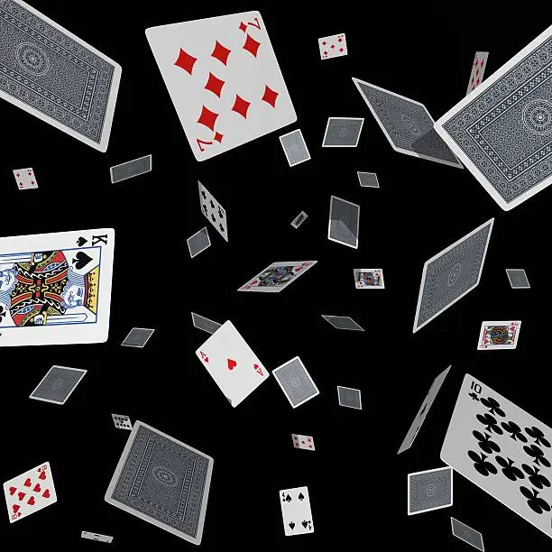 Photo of Tumbling cards on black