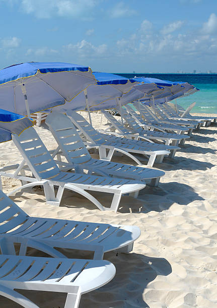 istock Beach Lounge Chairs On Caribbean Sea 173827359