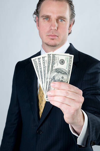 istock Businessman making money 173827373