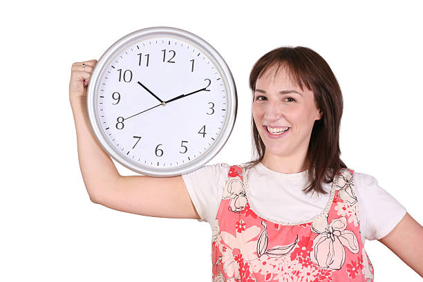 istock Woman Showing A Wall Clock 173828154