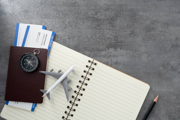 istock Passport with boarding pass and note book on stone texture background. Tourism and travel concept. Top view. Flat lay. 1738287948