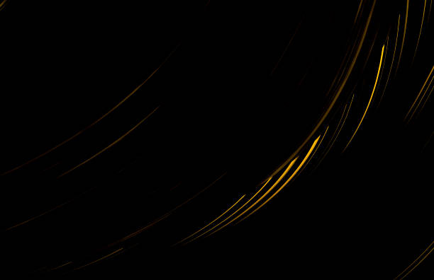 Airplane vapor trail across the golden sky at sunset
