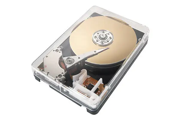 "An unusual computer hard drive with a transparent case that reveals the internal components. These include the platter, spindle, actuator and actuator arm."
