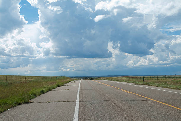 istock Prairie road with cloudy sky. 173829932
