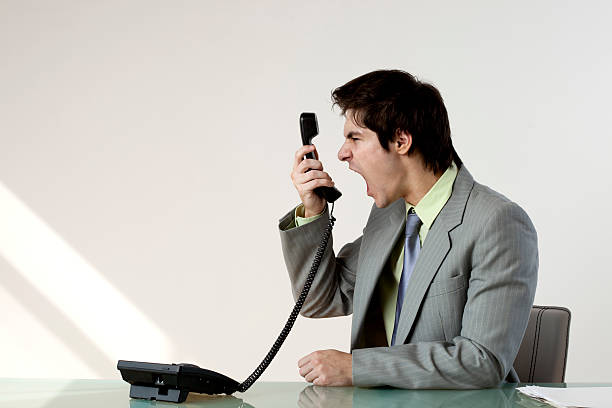 istock Businessman screaming into phone 173829934