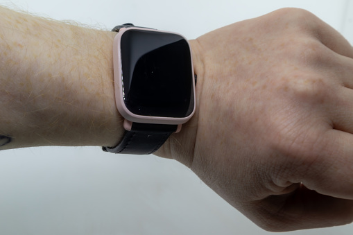 Human wrist wearing smartwatch