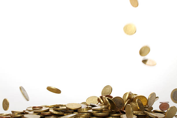 Gold euro coins falling and forming a pile 