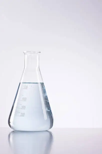 Photo of Closeup of conical flask filled with liquid