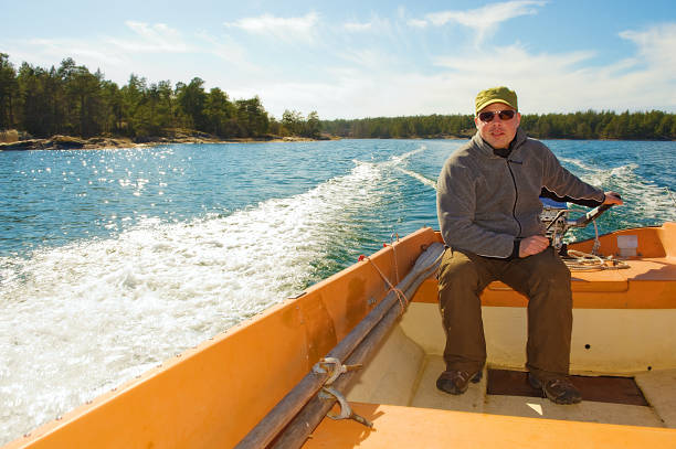 istock Man in a boat going fishing 173831405