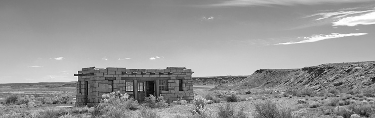 Lone adobe southwest home in Arizona United States - black and white