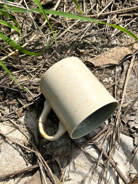 istock dirty mug on the ground 1738319925