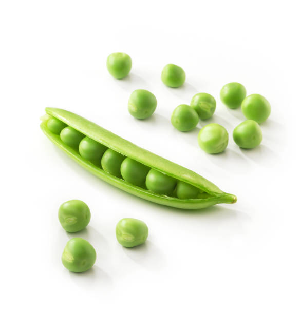 A pod full of green peas on a white background