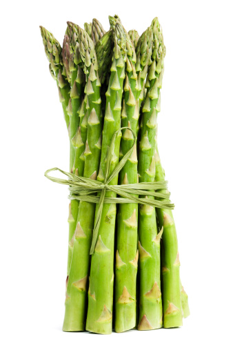 Subject: A bundle of green asparagus isolated on a white background.