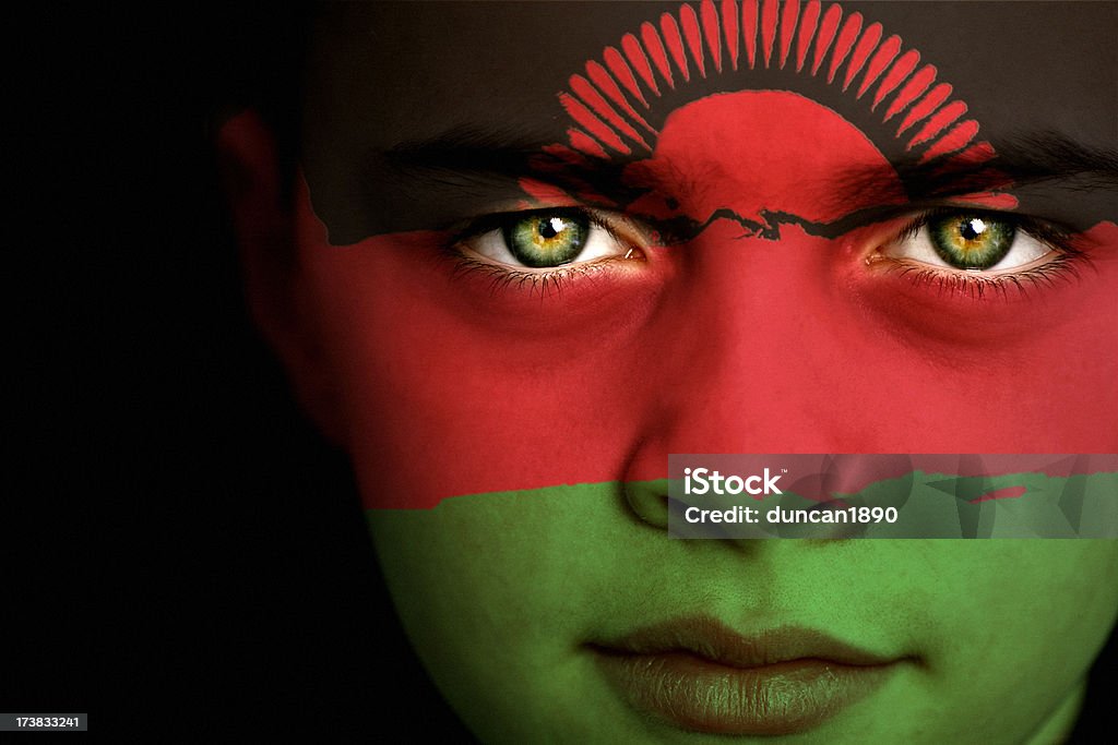 Malawi flag boy Portrait of a boy with the flag of Malawi painted on his face Boys Stock Photo