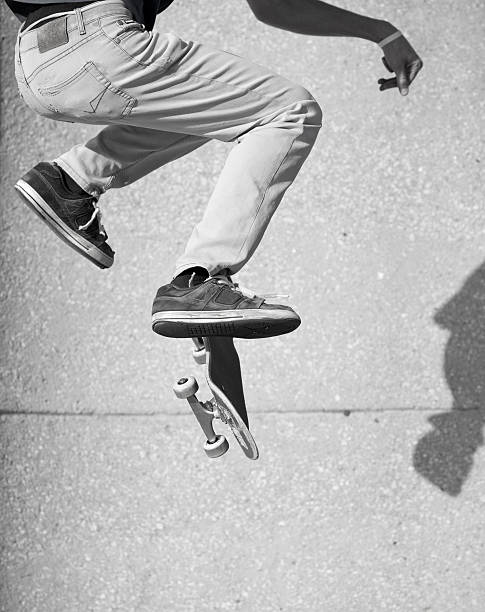 istock Skateboarder jumping height in violet color background 173833360