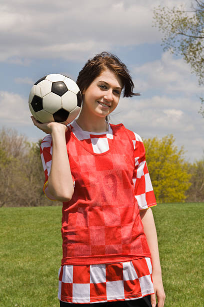 istock Young Girl Soccer Player with her Ball 173833653