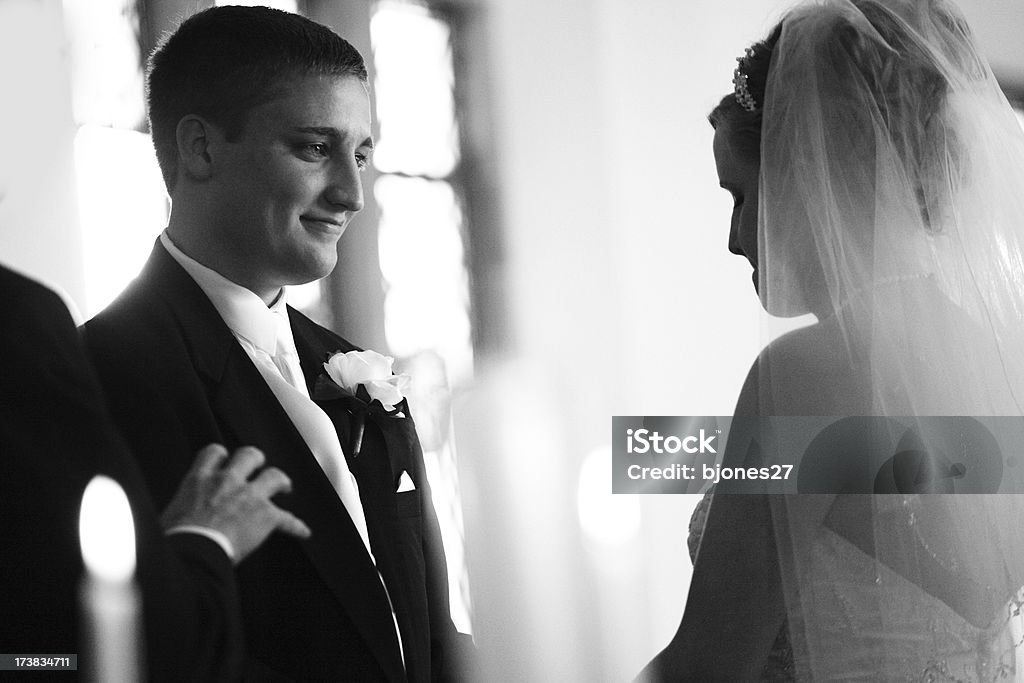 Wedding Vows "Man and woman about to be married. He smiles, she bites her lip.More wedding:" Bride Stock Photo